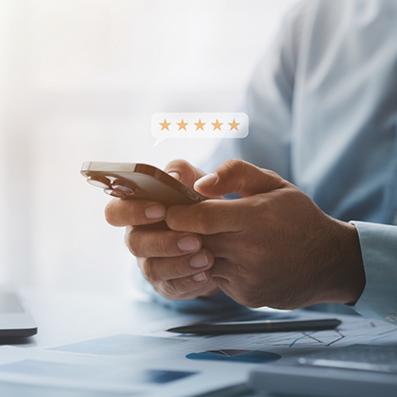 Person leaving a five star review on their phone