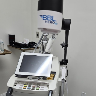 Gray machine with a small screen attached labeled B B L HEROic