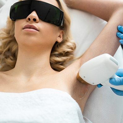 Woman receiving laser hair removal on her armpit