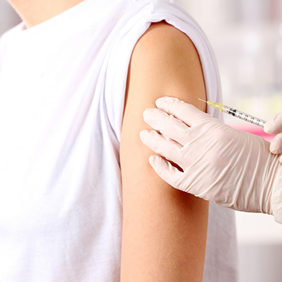 Patient receiving an injection in their upper arm